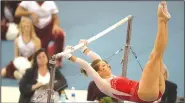  ?? NWA Democrat-Gazette/CHARLIE KAIJO ?? Arkansas’ Braie Speed performs on the bars during a Jan. 26 meet at Barnhill Arena in Fayettevil­le. Speed has been a mainstay on the vault and uneven bars with a 9.95 on the bars this year tying the school record.