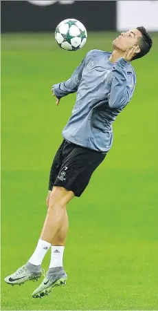  ?? MARTIN MEISSNER/THE ASSOCIATED PRESS ?? Real Madrid’s Cristiano Ronaldo practises prior to the Champions League Group F soccer match against Borussia in Dortmund, Germany on Monday.