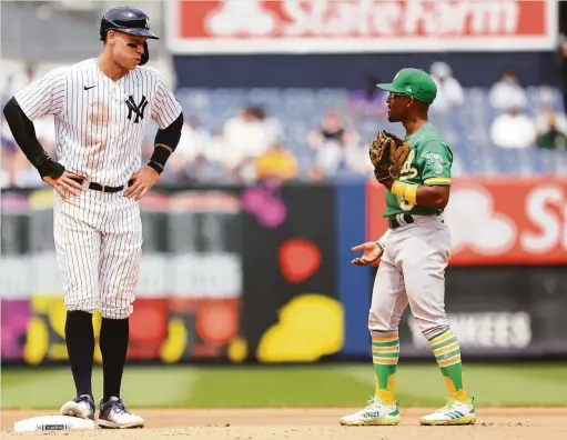  ?? Rich Schultz / Getty Images ?? The height of competitio­n: The Yankees’ Aaron Judge and the A’s Tony Kemp in New York in June. The teams now play four in Oakland.