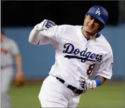  ?? BY JAE C. HONG ?? In this 2018 photo, then-los Angeles Dodgers’ Manny Machado celebrates his two-run home run against the Atlanta Braves during the first inning of Game 2 of a baseball National League Division Series, in Los Angeles.