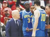  ?? Associated Press ?? UCLA head coach Mick Cronin (left) disputes a flagrant foul call with an official (right) against Washington State, March 2, in Pullman, Wash.