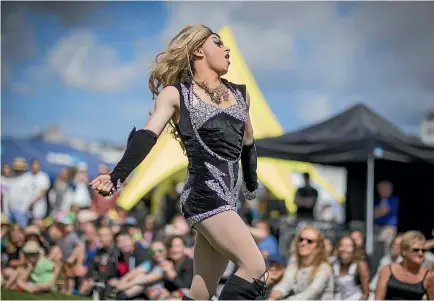  ?? PHOTOS: ROBERT KITCHIN/STUFF ?? Kelly Fornia, from the Gag Drag Collective, performs at Out In The Park on Saturday, launching this year’s Wellington Pride Festival.