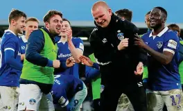  ?? ACTION IMAGES ?? For Pete’s sake: Oldham players mob caretaker Wild