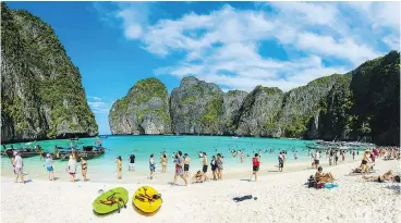  ?? — GETTY IMAGES FILES ?? Maya Bay, which is surrounded by 100-metre-high sheer cliffs, is where the movie The Beach was filmed. Due to overtouris­m, the beach has been closed.