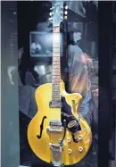  ?? [AP PHOTO] ?? The 1960 Maton EG240 guitar of Keith Richards which fell apart during a recording of “Gimme Shelter” is photograph­ed as part of Exhibition­ism.