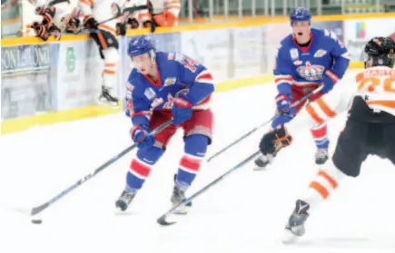  ?? CITIZEN PHOTO BY JAMES DOYLE ?? Prince George Spruce Kings forward Jarod Hovde looks to get the puck on net past Trail Smoke Eaters defender Ethan Martini on Wednesday night at Rolling Mix Concrete Arena. In their final regular-season home game, the Kings beat Trail 3-1.