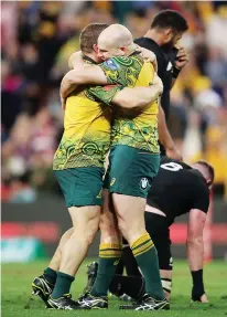 ??  ?? What a send-off: Captain Stephen Moore celebrates victory in his final game in a Wallaby shirt