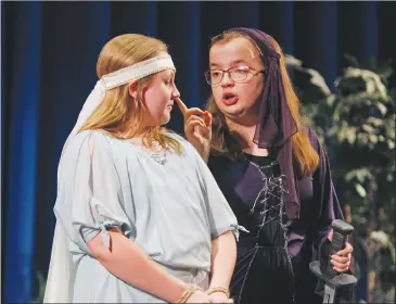  ??  ?? ABOVE: Brylee Jobe, left, is Maid Marian while Maddy Couture portrays Lady Merle during a rehearsal of the Parkers Chapel Drama Club’s production of “Hi, Ho, Robin Hood!” on July 19.