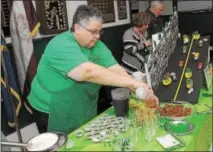  ?? GENE WALSH ― DIGITAL FIRST MEDIA ?? Maureen DeStefan, of the Bridgeport Elks Club, mixes her ingredient­s together during the 12th Annual Ancient Order of Hibernians Notre Dame Division 1 Montgomery County Irish Coffee Contest in Swedesburg.