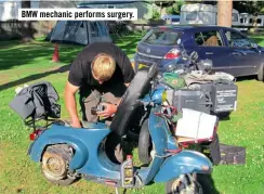  ??  ?? BMW mechanic performs surgery.