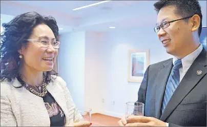  ?? ."63&&/ $06-5&3 5)& (6"3%*"/ ?? Winnie Liao, left, and Ricky Liu chat before the opening ceremony of the P.E.I. Immigratio­n Entreprene­urship Foundation at The Holman Grand Hotel Friday (April 7). Liu, chairman of the organizati­on, hopes to help fellow immigrants settle on P.E.I. by...