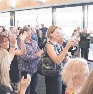  ?? Pictures: CAVAN FLYNN, JERAD WILLIAMS ?? Family, friends and colleagues raise a toast in farewellin­g former John Burton (below) at Allambe Memorial Park yesterday. Gold Coast Bulletin editor