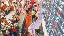  ?? REUTERS ?? Dragon dancers perform inside a trading floor at the Philippine Stock Exchange.