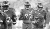  ?? JIM RASSOL /SUN SENTINNEL ?? FAU played in a deluge at times against FIU.