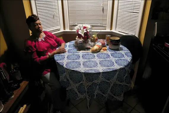  ?? PAUL SANCYA — THE ASSOCIATED PRESS ?? Karla Jefferies sits in her kitchen March 5 in Detroit.