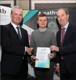  ??  ?? Denis Leamy, CETB cheif executive presenting Declan O’Donoghue, Colaiste Treasa, Kanturk, with his Student of the Year Award, with John Murphy, principal of Colaiste Treasa.