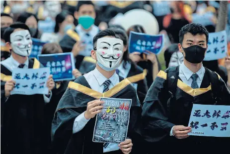  ?? /AFP ?? Resistance: Students wear Guy Fawkes masks at the Hong Kong Polytechni­c University on November 5, defying the ban on face masks and simultaneo­usly identifyin­g themselves with anti-establishm­ent hackers and protesters globally.