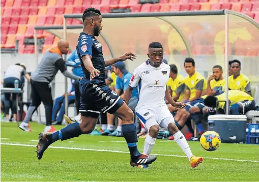  ?? Picture: WERNER HILLS ?? TUSSLE ON: Wits defender Thulani Hlatshwayo, left, tries to steal the ball from Chippa centre-back Paseka Mako at the Nelson Mandela Bay Stadium