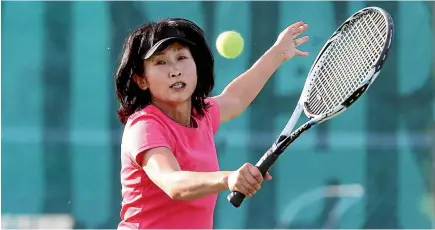  ?? PHOTO: SCOTT HAMMOND ?? Renwick Whitehaven’s Mieko Kimura plays a high backhand during her side’s match with Rapaura Drylands at the Forrest Winery Marlboroug­h Tennis Centre on Tuesday evening.