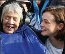  ??  ?? Doting: On a charity walk with her grandmothe­r