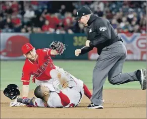  ?? Luis Sinco Los Angeles Times ?? RED SOX’S EDUARDO NUNEZ is out at second base after getting tagged by Angels second baseman Ian Kinsler trying for an extra base in the fourth inning.