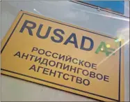  ?? AP-Alexander Zemlianich­enko, File ?? A RUSADA sign reads: “Russian National Anti-doping Agency” on a building in Moscow, Russia. Russia is accused of manipulati­ng an archive of doping data from a laboratory in Moscow, which was meant to be a peace offering to the World Anti-Doping Agency to solve earlier disputes.