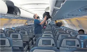  ?? JONATHAN HAYWARD THE CANADIAN PRESS ?? Airlines and airports around the world are taking safety measures to instill confidence in flyers; however, consistenc­y is still an issue, and it’s unclear whether these efforts will be enough.
