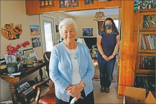  ?? (AP/Jeff Swinger) ?? Marjan Martin Curtis (left) and Amy Baird pose at Curtis’ home in Spanish Fork, Utah.