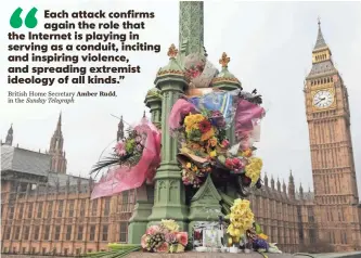  ??  ?? DAN KITWOOD, GETTY IMAGES Flowers are left Monday on Westminste­r Bridge near the Houses of Parliament in memory of those who died in last week’s terror attack in London.