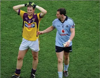  ??  ?? Dublin’s Philly McMahon consoling a devastated David Murphy after the game.