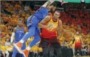  ?? RICK BOWMER — THE ASSOCIATED PRESS ?? Oklahoma City Thunder center Steven Adams (12) fouls Utah Jazz center Rudy Gobert (27) in the second half during Game 3 of an NBA basketball first-round playoff series Saturday in Salt Lake City. The Jazz won 115-102.