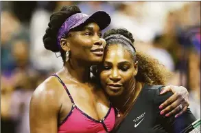  ?? Julian Finney / Getty ?? Serena Williams is congratula­ted by her sister and opponent Venus Williams at the USTA Billie Jean King National Tennis Center on Aug. 31, 2018 in New York.