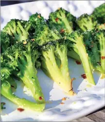  ?? The Associated Press ?? Weekday sauteed broccoli is pictured.This recipe for weekday side dish calls for broccoli but you could easily substitute cauliflowe­r or carrots or asparagus.