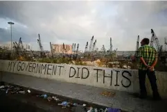  ??  ?? Graffiti at the damaged port area in the aftermath of the blast (Reuters)