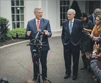  ?? Kent Nishimura Los Angeles Times ?? HOUSE SPEAKER Kevin McCarthy, left, and Senate Minority Leader Mitch McConnell speak to reporters Tuesday. The 14th Amendment makes it unconstitu­tional to default on the national debt, some experts say.