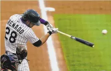  ?? Jack Dempsey / Associated Press ?? The Colorado Rockies’ Nolan Arenado, seen batting in the third inning, hit his first homer of the season in the sixth.