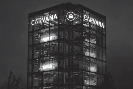  ?? Emily Elconin/bloomberg ?? After soaring during the pandemic, Carvana is in trouble, with indication­s of default by the end of 2023.