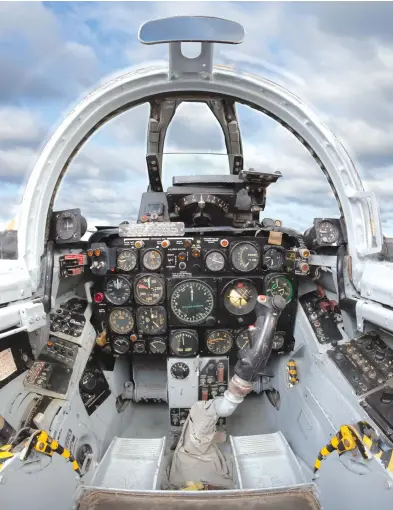  ??  ?? Prominentl­y featured above the instrument panel of the F-86F Sabre is the A-1CM gunsight, coupled with the APG-30 radar to compute range automatica­lly. Ejectionse­at handles are marked with yellow and black bands. (Photo by Brian Silcox)