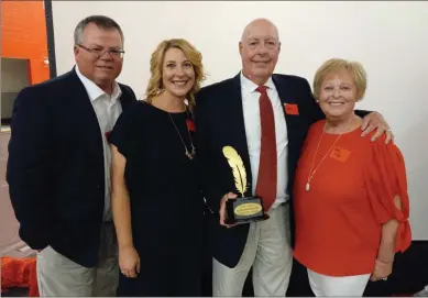  ?? J.J. Morris. Scott Herpst ?? Former LFO coach Chip Liner stands with his wife, Judy, daughter Amy Allen and son-in-law John Allen shortly after receiving the Jerry Jones Legacy Builder Feather Award at the 2022 LFO Feather Awards ceremony this past Tuesday. Not pictured was Liner’s daughter Betsy Morris and son-in-law