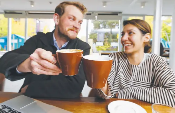  ?? Picture: MATT THOMPSON ?? CUPPA: Having a coffee at Lazenby's Cafe at the University of Tasmania are Hobart students Dylan Keegan and Angela Abolhassan­i.