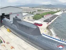  ?? ?? The unveiling ceremony of the new submarine No. 841, named the Hero Kim Kun Ok, at an undisclose­d location in North Korea