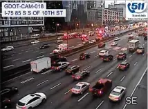  ?? GDOT VIA TWITTER ?? A GDOT traffic camera shows the effects of a crash Tuesday on I-75/85 in Midtown. Rain wreaked havoc during the morning drive and closed several lanes of the Downtown Connector.