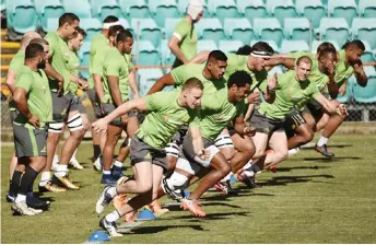  ?? — AFP photo ?? File photo of Australian rugby players taking part in training session.