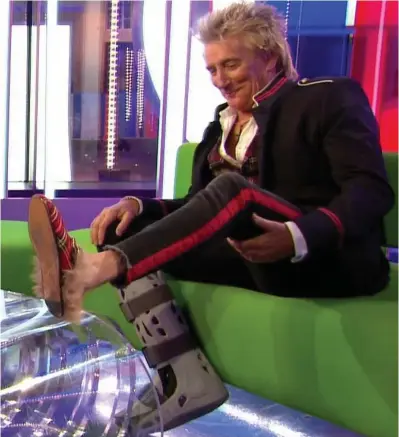  ??  ?? Playing for kicks: Sir Rod shows off his varied footwear while appearing on The One Show