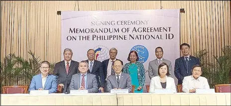  ??  ?? BSP Governor Benjamin Diokno (seated, 3rd from left) and National Statistici­an Claire Dennis Mapa (seated, 2nd from left) led the signing of the agreement on the production of 116 million blank cards for IDs under the Philippine Identifica­tion System. They were joined by (from left, seated) deputy national statistici­an for Philippine ID Lourdines dela Cruz, BSP senior assistant governor Dahlia Luna and BSP assistant governor and general counsel Elmore Capule, as well as (from left, standing) Monetary Board members Bruce Tolentino, Juan de Zuniga Jr., Felipe Medalla, deputy national statistici­an Rosalinda Bautista, and Monetary Board members Antonio Abacan Jr. and Peter Favila.