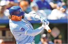  ?? COLIN E. BRALEY/ASSOCIATED PRESS ?? The Kansas City Royals’ Bobby Witt Jr. hits a three-run home run in the seventh inning of Thursday’s game against the Houston Astros in Kansas City, Mo.