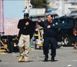  ?? ARIC CRABB — STAFF PHOTOGRAPH­ER ?? Daryel Dunston, left, of the Oakland Human Services Department, and an Oakland police technician walk through a homeless camp on March 4, 2020, in Oakland.