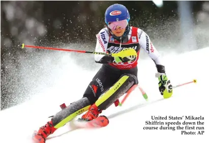  ??  ?? United States’ Mikaela Shiffrin speeds down the course during the first run Photo: AP