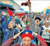  ?? AP ?? Russian fans celebrate the 31 win over Egypt.