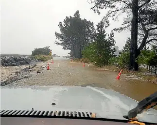  ?? PHOTO: NINA HINDMARSH ?? The road from Collingwoo­d to Puponga, near Farewell Spit in Golden Bay, was closed after a severe washout.